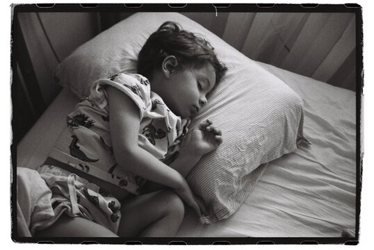 Cute Todler Is Sleeping In His Bed