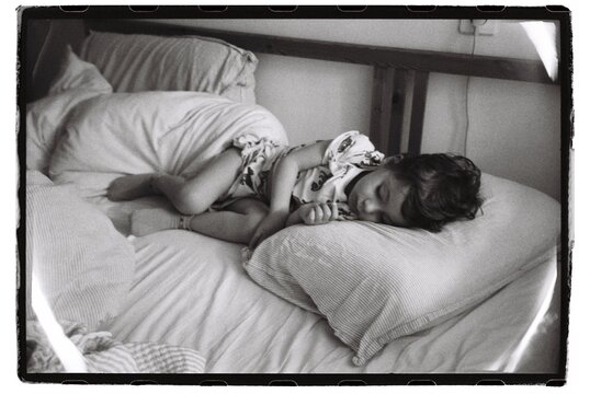 Cute Todler Is Sleeping In His Bed