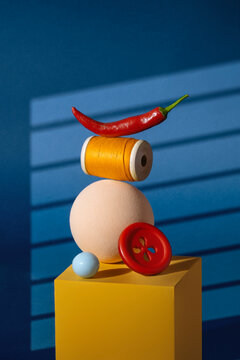 Abstract Still Life with colorful objects on yellow podium