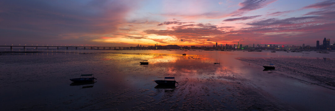 Lau Fau Shan shoreline Shenzhen Bay Bridge sunset Hong Kong