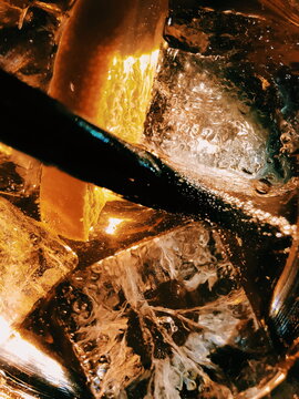 Refreshing beverage with ice and citrus at night