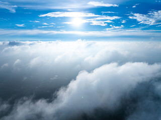 Aerial View of Mountain Peaks and Sea of Clouds with Rain Clouds