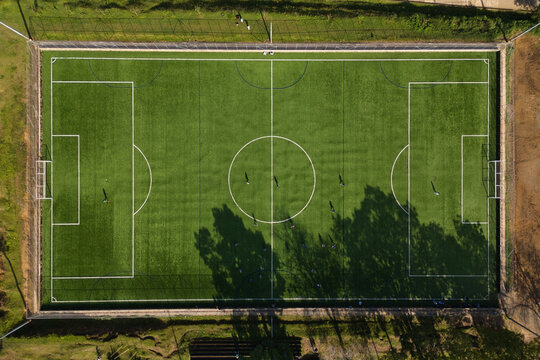 People playing soccer on a field