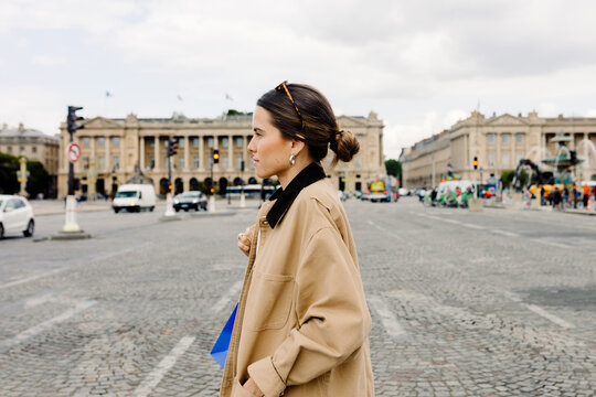 Female tourist enjoying a walk through Place de la Concorde in Paris