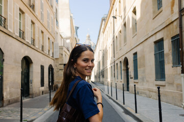 Portrait of a visitor strolling along urban streets in central Paris