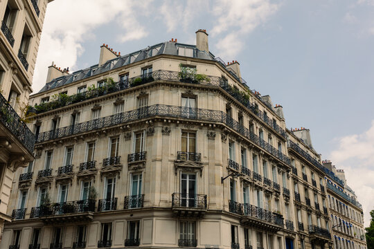 Classic rustic building fronts lining Paris streets