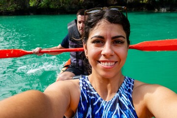 woman taking selfie while kayaking