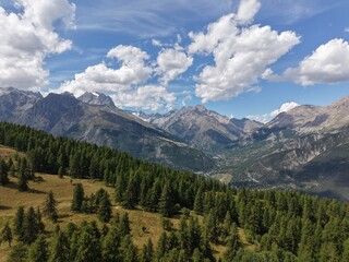 Alpine Wilderness | Les Écrins National Park – Summit ViewAerial drone photo of a pristine alpine summit in the French Alps, taken in the heart of Les Écrins National Park. Rolling ridge-lines