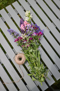 Freshly cut flowers and string
