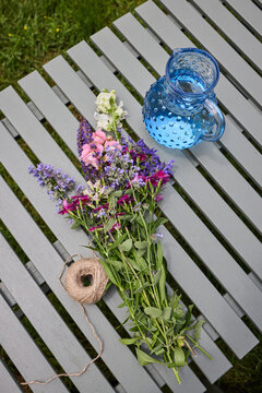 Freshly cut flowers and string
