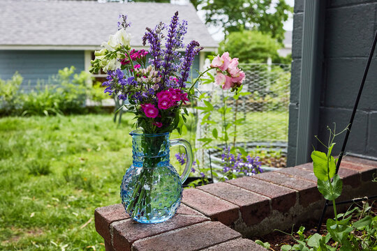 Freshly cut flowers in blue vase