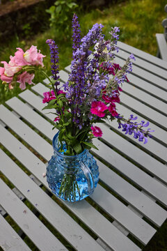 Freshly cut flowers in blue vase