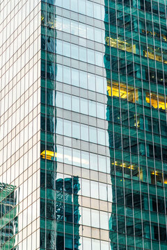 Grid overlays with yellow light on office buildings