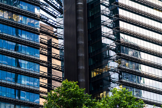 City reflections and linear patterns in office buildings