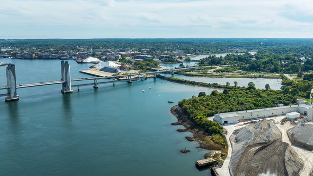 Aerial views of the Sarah Mildred Long Bridge spanning the Piscataqua River with Portsmouth and surrounding coastlines visible.