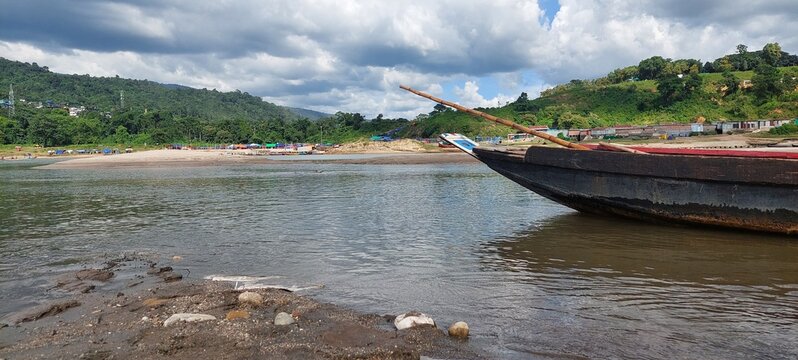Curated image of beautiful landscape of jaflong, bangladesh with boat on the water edge.