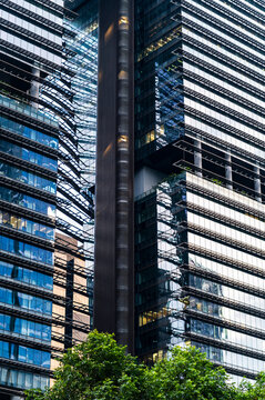 Modern glass skyscrapers with overlapping glass surfaces