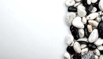 Assorted pebbles arranged on a white background