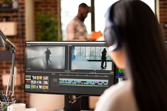 Remote filmmaker wearing headphones edits dance video footage at home studio. Female editor enhancing movement and rhythm on film montage, crafting cinematic content for visual storytelling.