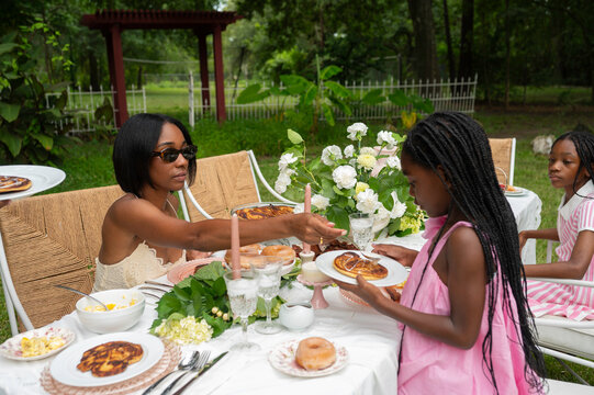 Family Enjoys Summer Brunch Outdoors With Delicious Pancakes