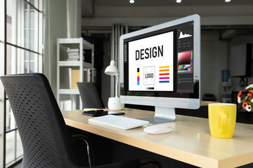 Graphic designer software for modern design of web page and commercial ads showing on the computer screen