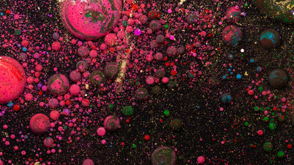Abstract red pink blue bubbles on black background cosmic liquid art texture