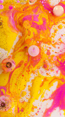 Vibrant abstract background with yellow pink orange liquid bubbles marble texture summer art design