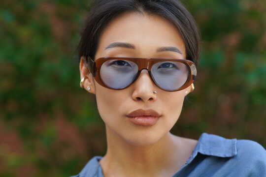 Close-up portrait of young asian girl with glasses