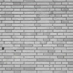 Monochrome brick wall background featuring a repeating pattern of rectangular bricks in varying shades of gray