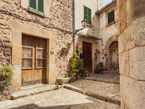Rustic Mediterranean courtyard with stone walls