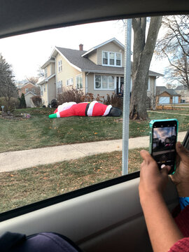 Inflatable Santa on a Lawn During the Holiday Season