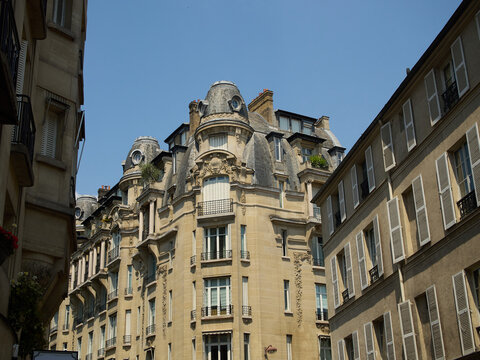 Historic Architecture in Paris Stands Proudly Under a Clear Blue Sky