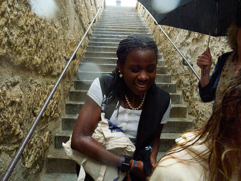 Happy Moments in the Rain on a Staircase During a Summer Outing