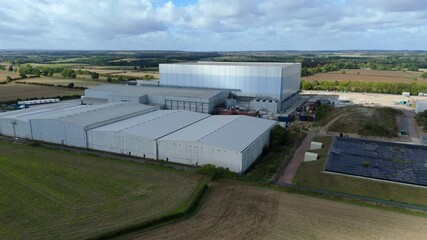 Aerial drone view of industrial cold storage facility, warehouse distribution centre and factories, rural English landscape near Grantham UK - Powered by Adobe