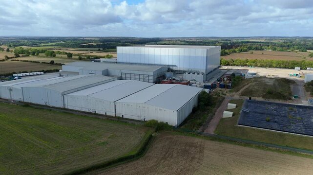 Aerial drone view of industrial cold storage facility, warehouse distribution centre and factories, rural English landscape near Grantham UK