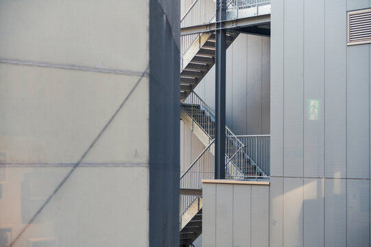 Outdoor emergency stairs between modern buildings