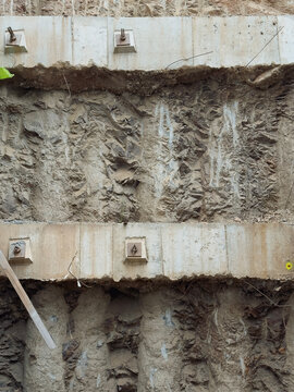 Rough Concrete Structure Integrated Into Exposed Rock Cliff Formation
