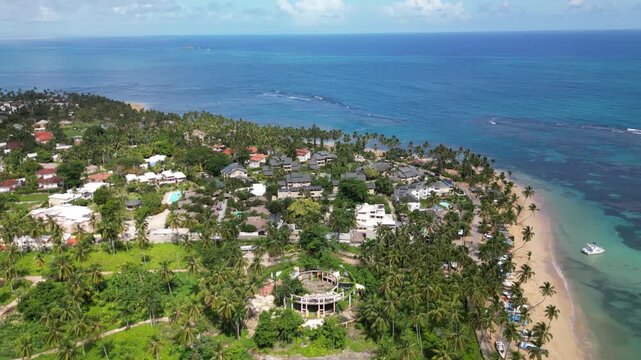 4K drone footage of Punta Popy Beach &mdash; sandy beach, turquoise ocean, and tropical palms. Best for travel ads and resort marketing