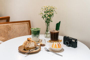 Cosy Cafe Table With Drinks and Desserts
