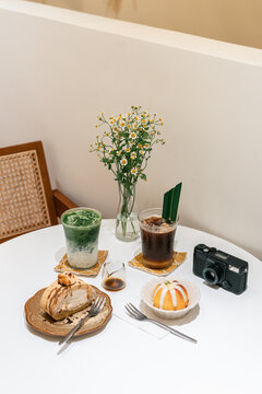 Cosy Cafe Table With Drinks and Desserts