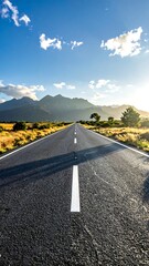 Empty road stretching to mountains