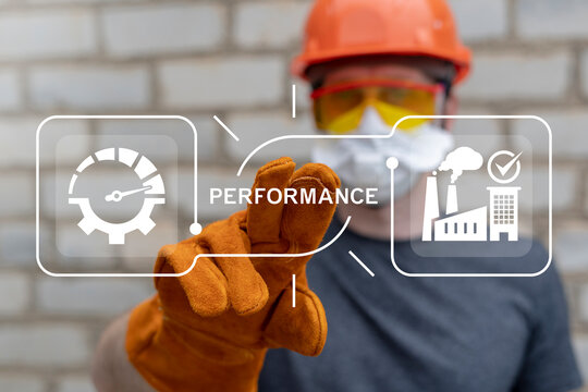 Industrial worker using virtual touch screen presses the word PERFORMANCE. Performance, Productivity, Efficiency Industry concept.