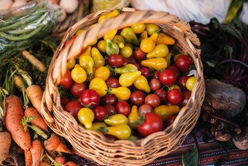 Basket of fresh cherry tomatoes at market
