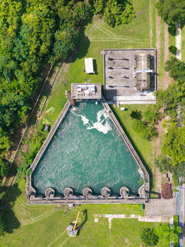 Aerial view of a water treatment plant with a triangular tank