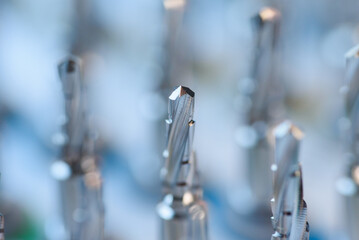Selective focus of dental implant drill bit in surgical tray, professional dentistry equipment