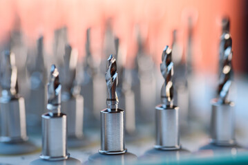 Selective focus of dental implant drill bit in surgical tray, professional dentistry equipment