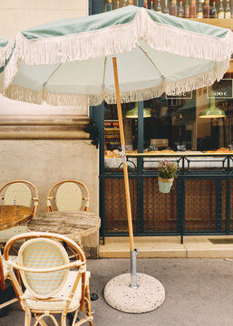 Vintage Cafe Umbrella Providing Shade at a Parisian Street Cafe