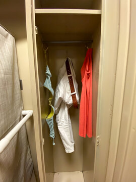 Woman's clothing hanging in locker before medical procedure