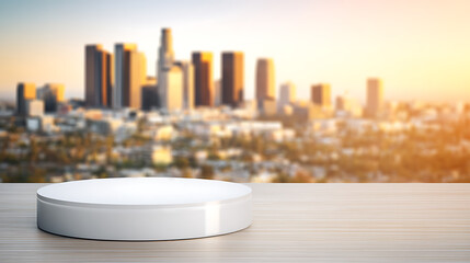 White circular platform on wooden surface with blurred city skyline at sunset