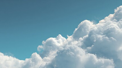 A breathtaking view of a vast, fluffy white cloud formation against a clear blue sky.